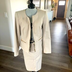 CK suit complete with jacket and blazer.  Tailored.  Gold zippers.